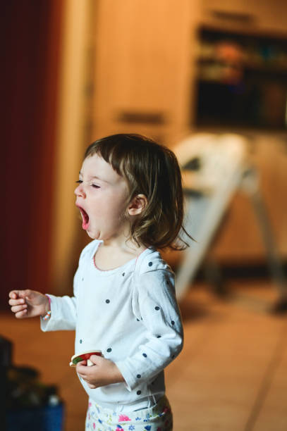 istock Little girl yawning. 2150681399