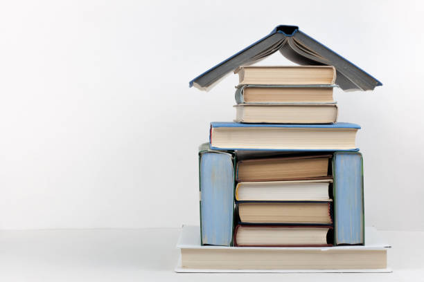 Open book, hardback colorful books on wooden table. Back to school. Copy space for text. Education business concept