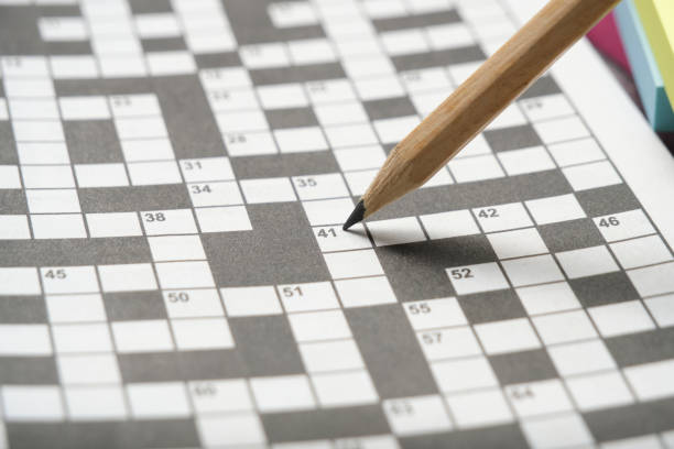 Simple pencil on background crossword puzzle sheet