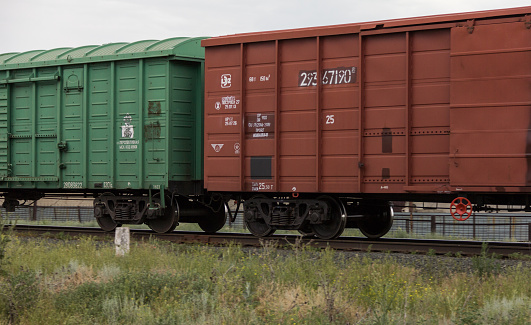 Uralsk, Oral, Kazakhstan (Qazaqstan), 19.06.2016: Railway covered freight cars. Rail transportation in Kazakhstan.