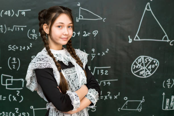 istock Retro School Elegance: Girl in Soviet Uniform with Braided Hair 2150684046