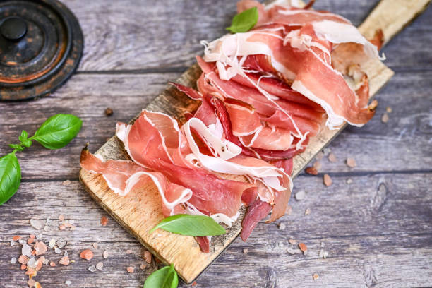 istock Prosciutto Crudo on a wooden  cutting board . 2150684096
