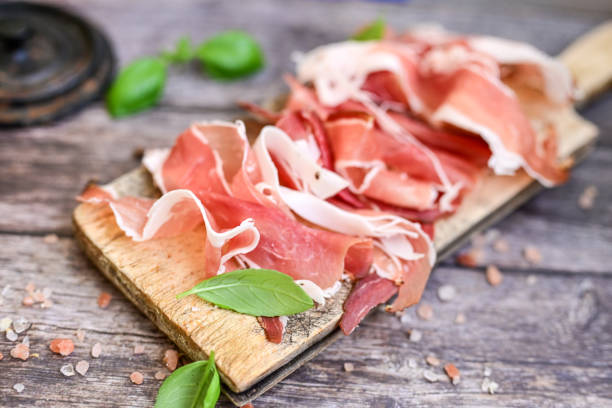 istock Prosciutto Crudo on a wooden  cutting board . 2150684613