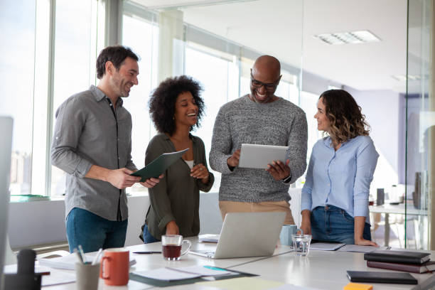istock Small diverse group of coworkers discussing business project 2150685376