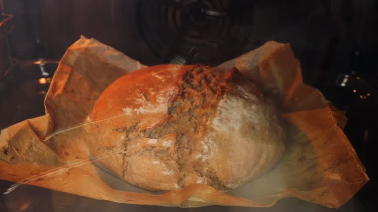 A timelapse of artisan bread in the oven. Preparation of homemade sourdough bread