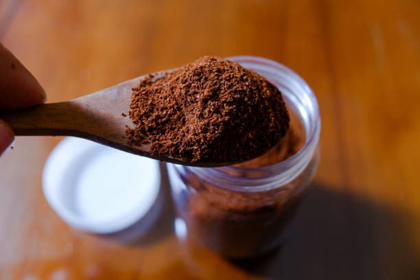istock One spoon of coffee powder, with table background 2150688596