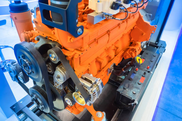 Car motor close-up. Diesel engine from the car. An orange engine pulled out of the car. Concept - sale of motors for vehicles. Concept - engine repair. Spare parts for diesel vehicles