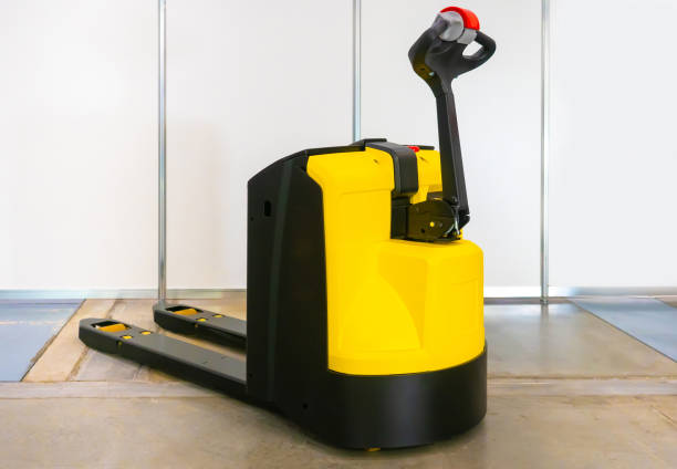 istock Electric pallet transporter. Cargo trolley. Loader. Electric trolley. Work in a warehouse. Transportation of goods. Pallet carrier escorted. Modern equipment for the warehouse. Warehouse Stacker. 2150692293
