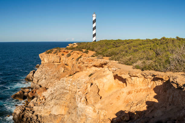 Panoramic view of Punta Moscarter lighthouse near Portinatx, Sant Joan de Labritja, Ibiza, Balearic Islands, Spain