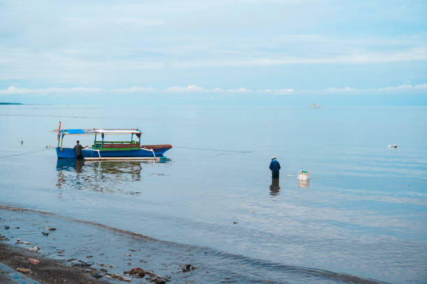 Fishermen looking for fish on the beach