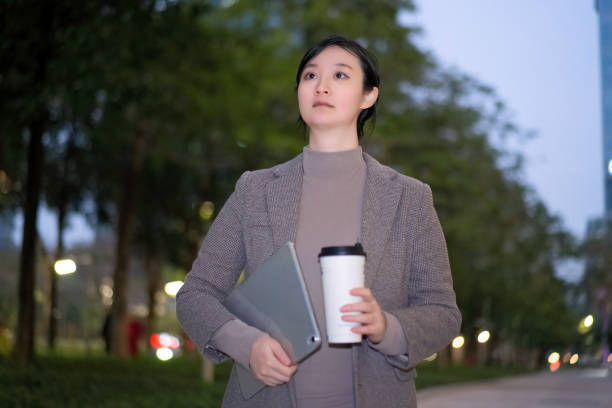 istock Professional Woman Contemplating Outdoors at Dusk 2150695757