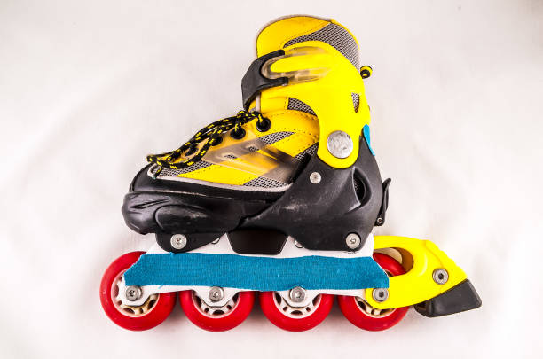 istock A yellow and black roller skate with a blue strap 2150696039