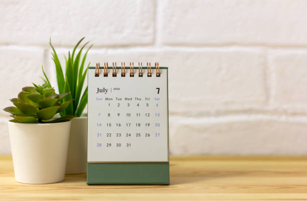istock Desk calendar for July 2024 on the table with copy space. 2150696114