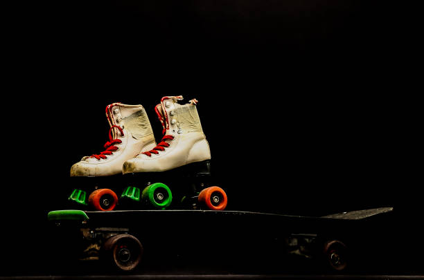 istock Two roller skates are on top of a skateboard 2150697234