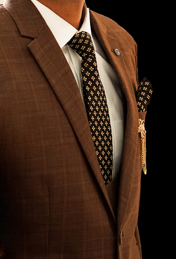 Professional Charm: Impeccable Suiting Accented with Pocket Square or Brooch