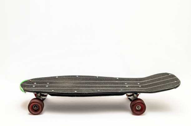 istock A skateboard with green wheels and a black deck 2150699092