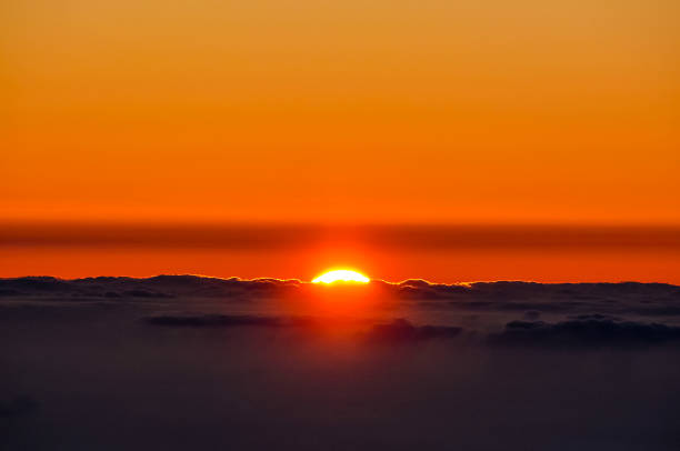 istock The sun is setting over the ocean, casting a warm glow over the water 2150699182