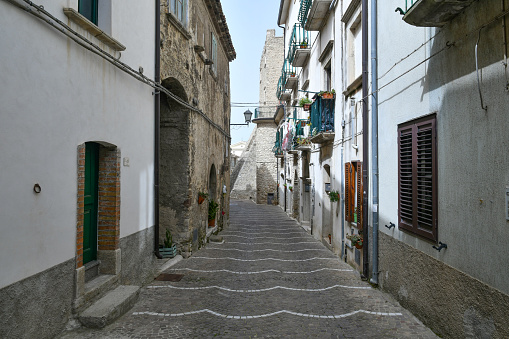 A street among the old houses of the medieval neighborhood of a town in the province of Campobasso.