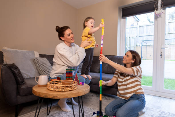 istock Lesbian Mothers and Daughter in Play 2150701541