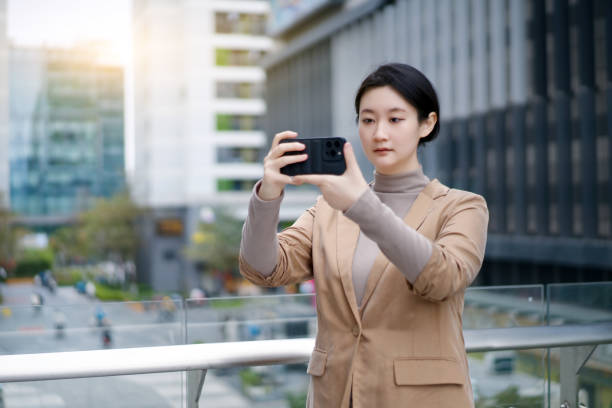 istock Young Woman Taking Selfie in Urban Environment 2150701647