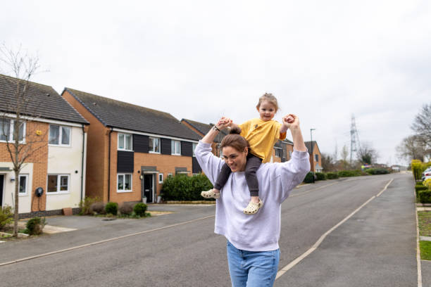 istock Mother carrying Daughter 2150702284