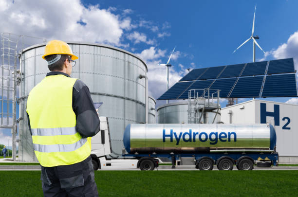 istock Engineer with tablet computer on a background of Green Hydrogen factory. 2150703401