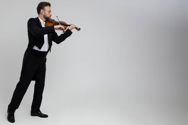 istock Elegant man violinist on stage performing concert 2150704706