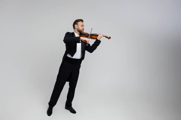 istock Elegant man violinist on stage performing concert 2150704708
