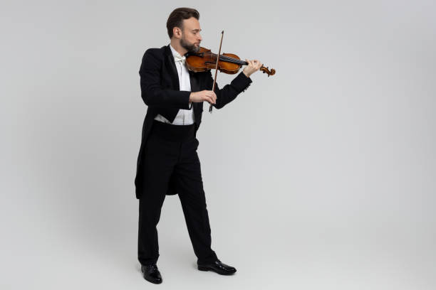 istock Bearded man passionate violin player at classical music performance 2150704738