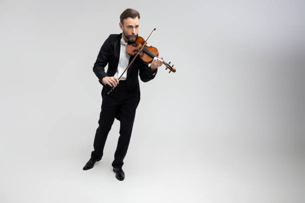 istock Bearded man passionate violin player at classical music performance 2150704872