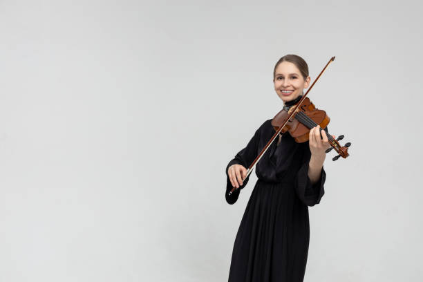 istock Woman musical artist playing violin 2150704965