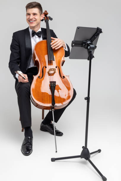istock Young male musician performing with cello and music note 2150705045