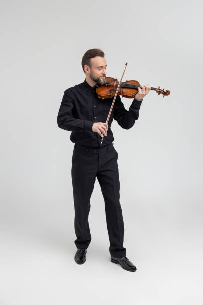 istock Bearded man violinist performing on concert 2150705080