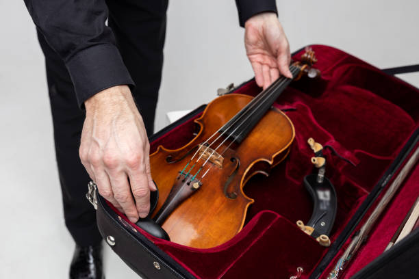 istock Unrecognizable violist man with instrument in case 2150705134
