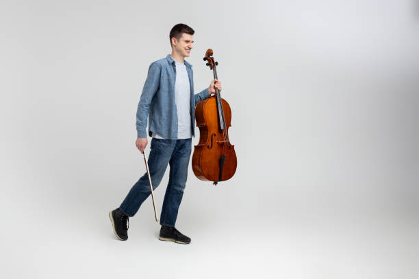 istock Handsome man musician playing cello on concert 2150705177