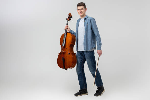 istock Handsome man musician playing cello on concert 2150705182