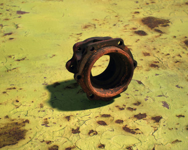 istock Rusty metal cover on weathered rusty green metal sheet. 2150705293