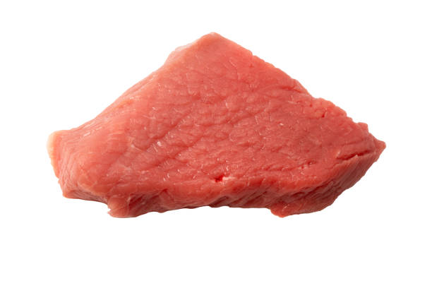 Carnivore diet. Plate with raw meat on white marble table.
