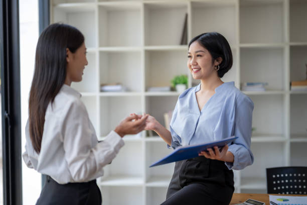 istock Two business colleagues chatting, sharing ideas. 2150705541