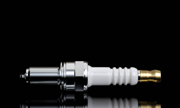 istock High-quality image of a spark plug isolated on a reflective black surface 2150705695