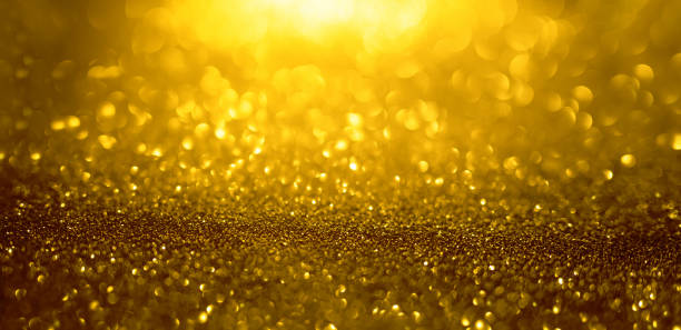 istock Abstract background of gold glitter lights. De-focused background 2150705724