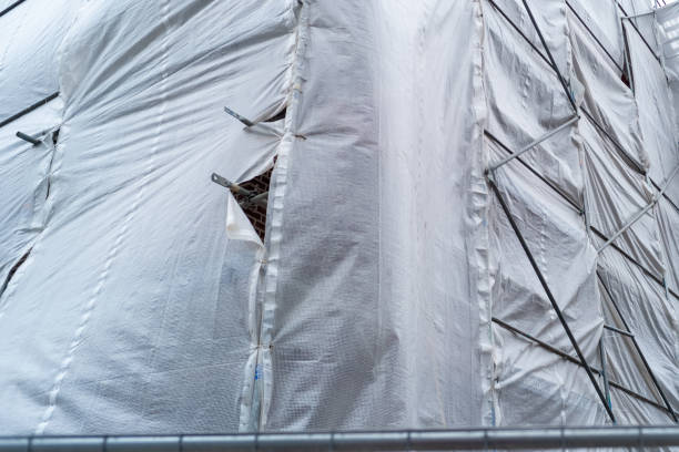 istock Building covered with a tarpaulin 2150706820