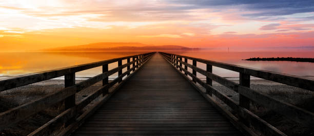 Landing stage at sunset to the horizon
