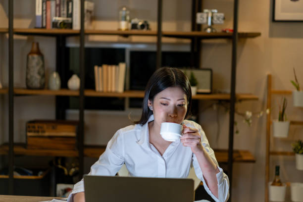 istock The young woman is working late into the night 2150708171
