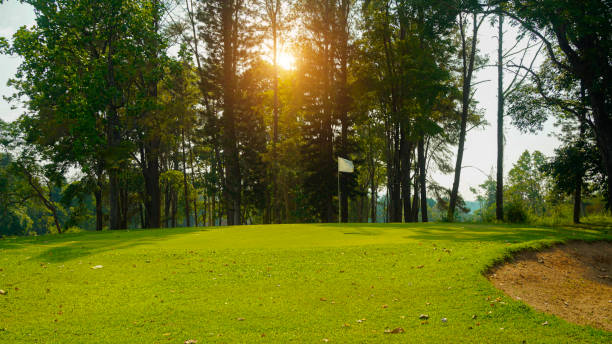 istock View of Golf Course with beautiful putting green. Golf course with a rich green turf beautiful scenery. 2150710373