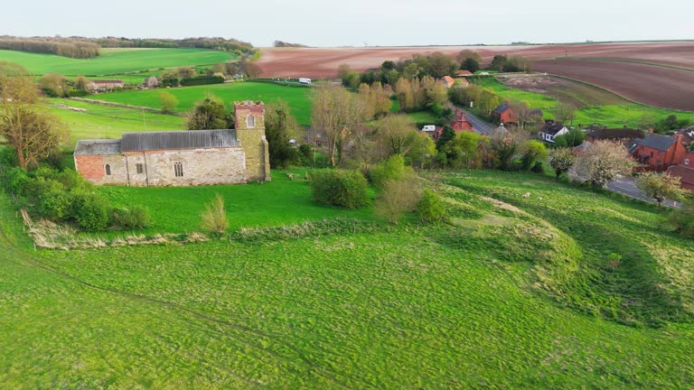 Aerial drone footage of a small Lincolnshire village called Burwell in the UK. Typical English rural village scene.