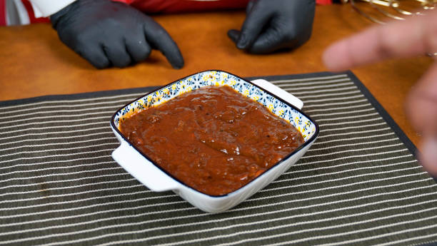 istock Tamarind Chutney on a beautiful mat on table - Indian cuisine 2150713138