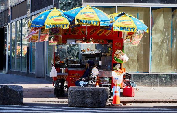 New York (United States), March 24, 2024. Mobile food stall on a street in New York. Sell simple things like hot dogs, hamburgers, baggle, drinks, etc.