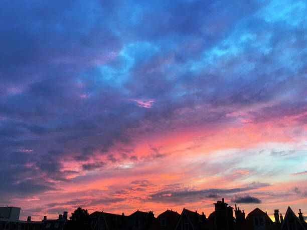A photograph of a pink and blue Dutch summer sky above The Hague, Netherlands
