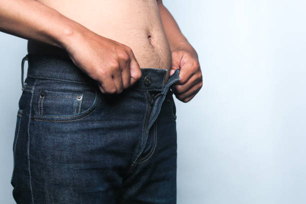 istock Trying to wear tight pants 2150713900